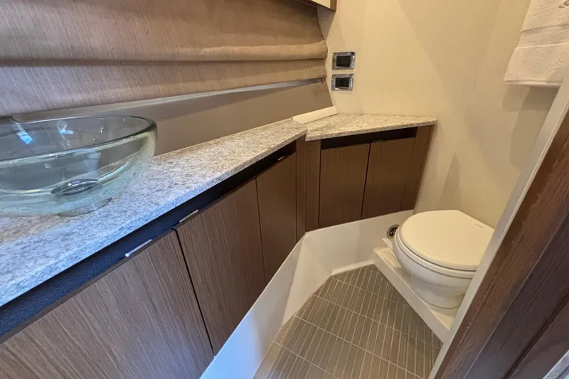 Slide: The Image of Luxurious bathroom in 2018 Sea Ray Sundancer 460 yacht with modern fixtures and elegant design. - 40
