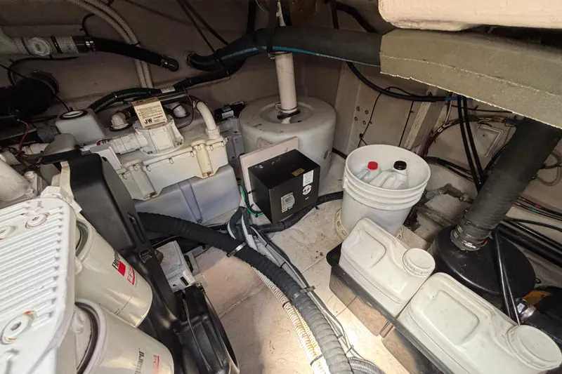 Slide: The Image of Engine room of 2018 Sea Ray Sundancer 460 with mechanical components and wiring. - 51