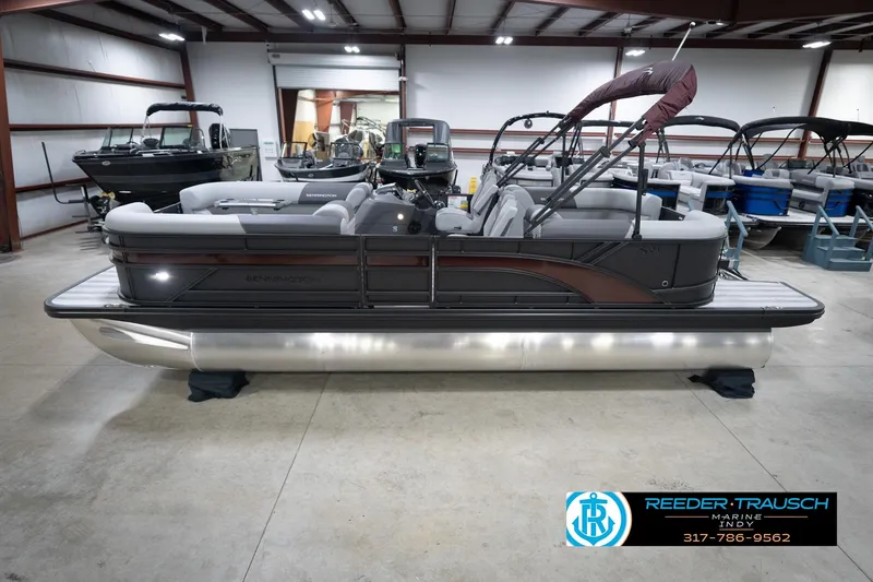 The Image of 2026 Bennington 23 SSR pontoon boat in showroom, side view, with sleek design and modern features. - 1