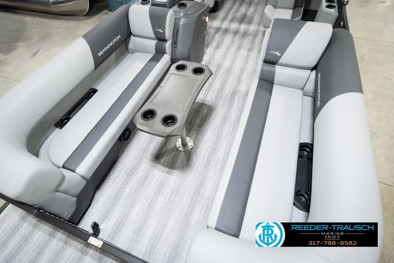 Slide: The Image of 2026 Bennington 23 SSR boat interior with gray seating and cup holders. - 11
