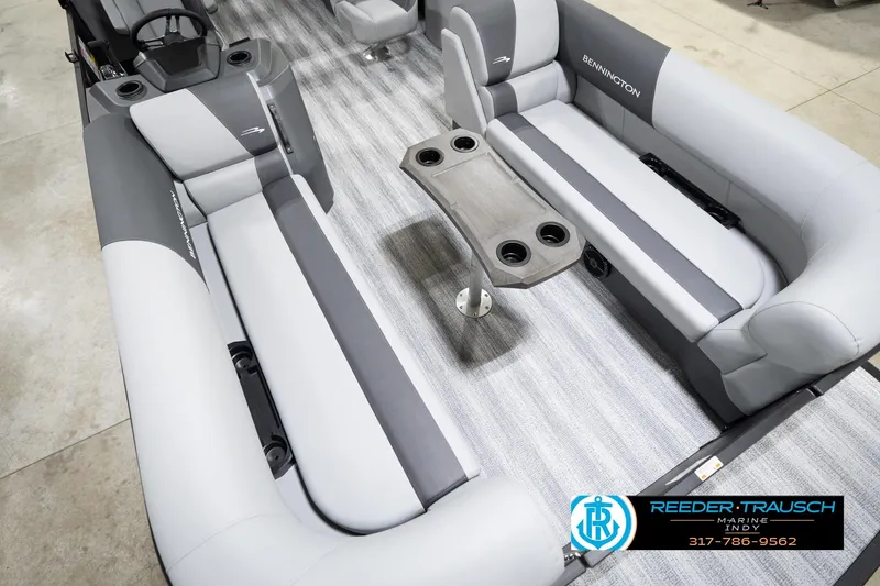 Slide: The Image of 2026 Bennington 23 SSR pontoon boat interior with gray seating and central table. - 12