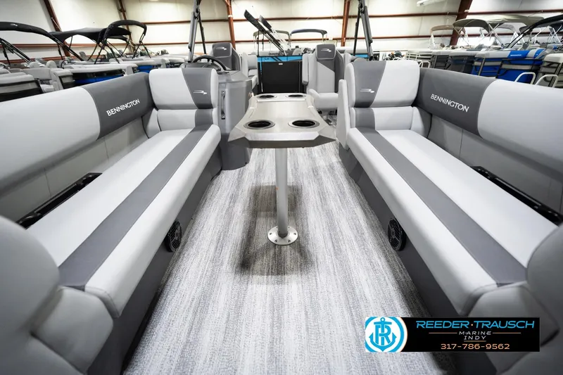 Slide: The Image of 2026 Bennington 23 SSR pontoon boat interior with gray seating and central table. - 15