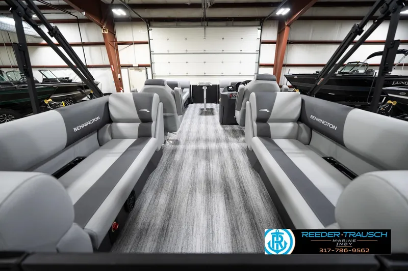 Slide: The Image of 2026 Bennington 23 SSR pontoon boat interior with gray seating in showroom. - 18
