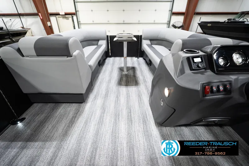 Slide: The Image of 2026 Bennington 23 SSR pontoon boat interior with modern seating and control panel. - 19
