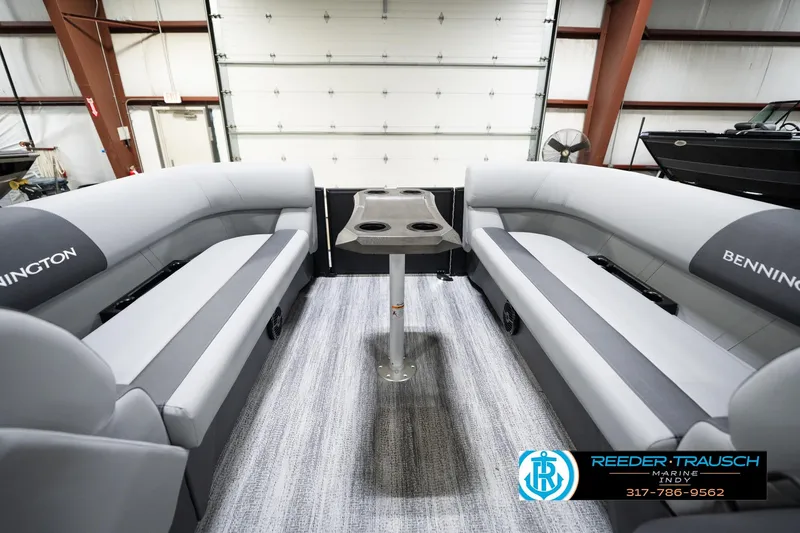Slide: The Image of 2026 Bennington 23 SSR pontoon boat interior with gray seating and central table. - 20