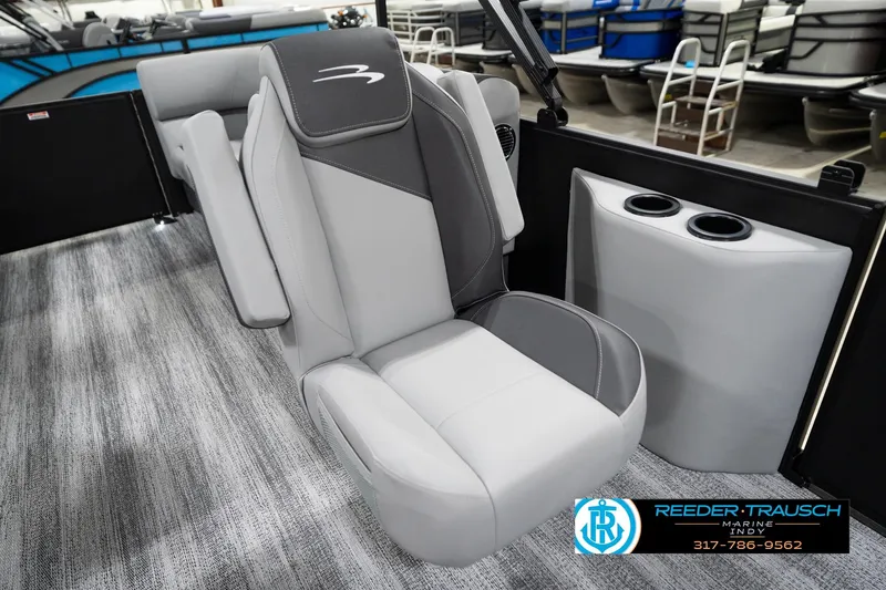Slide: The Image of 2026 Bennington 23 SSR boat interior with gray seating and cup holders. - 25