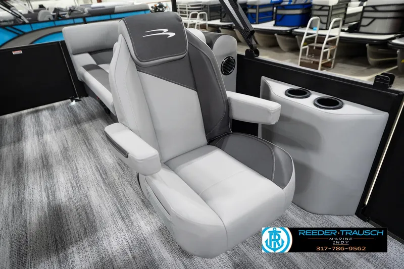 Slide: The Image of 2026 Bennington 23 SSR boat interior with plush seating and cup holders. - 26