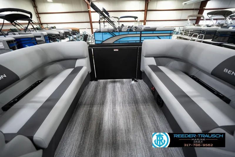 Slide: The Image of 2026 Bennington 23 SSR pontoon boat interior with gray seating in showroom. - 27