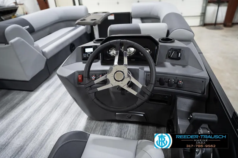 Slide: The Image of Interior of 2026 Bennington 23 SSR boat with modern steering and seating. - 29