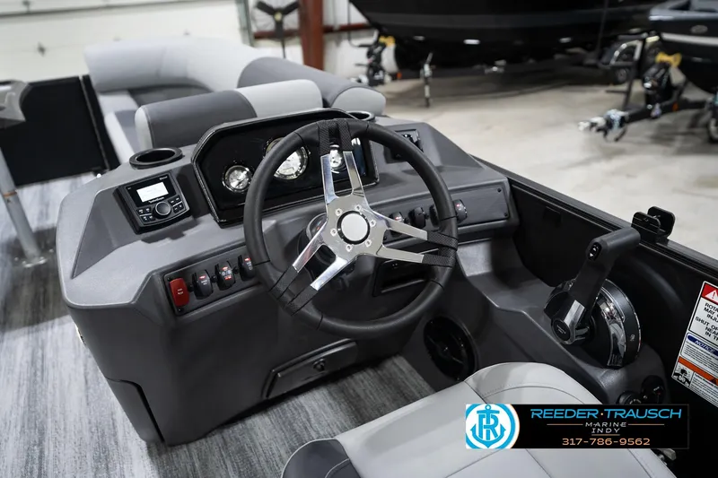 Slide: The Image of 2026 Bennington 23 SSR boat dashboard with steering wheel and control panel. - 30