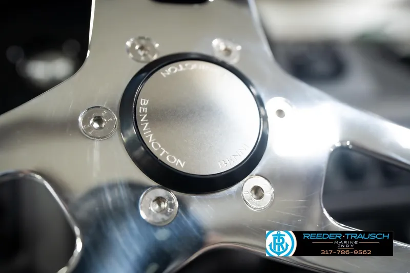 Slide: The Image of Steering wheel of 2026 Bennington 23 SSR boat, featuring sleek metallic design. - 31