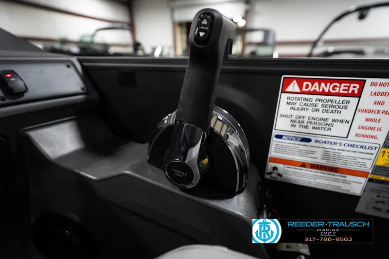 Slide: The Image of Throttle control and safety warnings on a 2026 Bennington 23 SSR boat dashboard. - 37