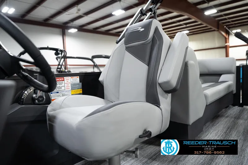 Slide: The Image of 2026 Bennington 23 SSR boat interior with modern seating and steering wheel. - 40