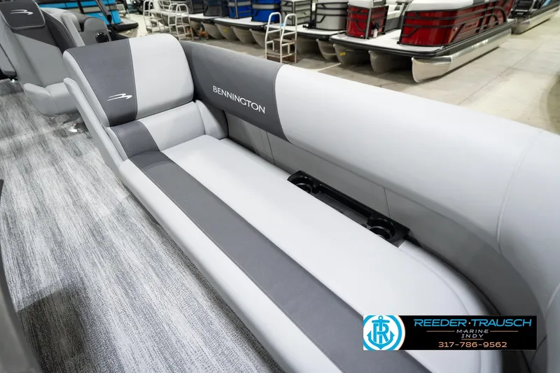 Slide: The Image of 2026 Bennington 23 SSR pontoon boat interior with gray seating and cup holders. - 44