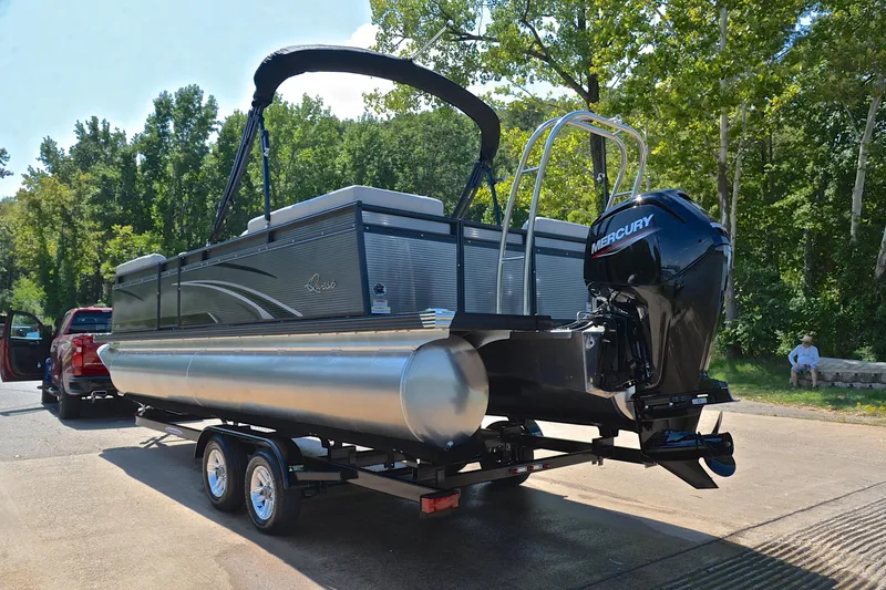 Slide: The Image of 2023 Qwest LT 822 pontoon boat on trailer with Mercury outboard motor. - 12