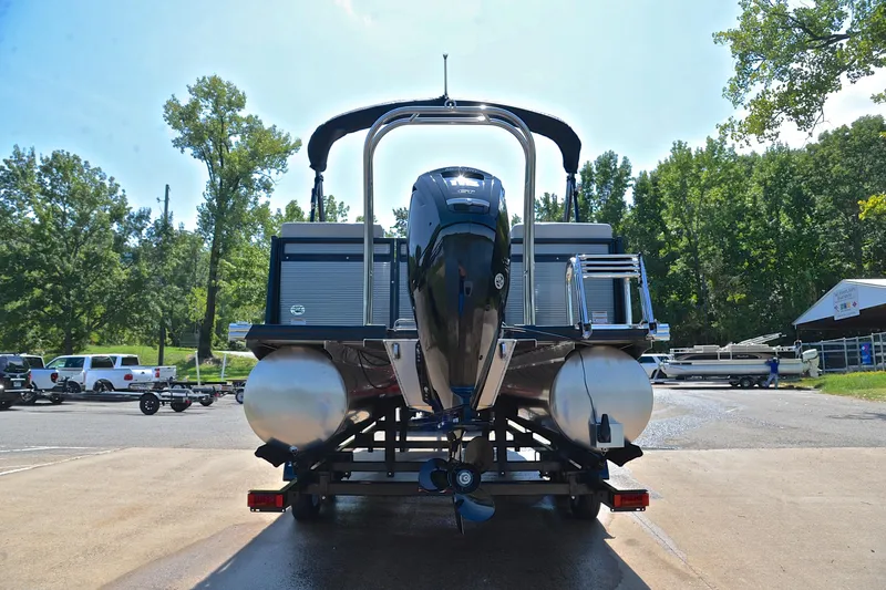 Slide: The Image of 2023 Qwest LT 822 pontoon boat on trailer, rear view, in a sunny outdoor setting. - 13