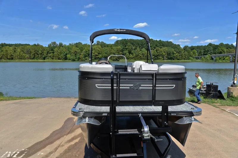 Slide: The Image of 2023 Qwest LT 822 pontoon boat on trailer by a scenic lake. - 17