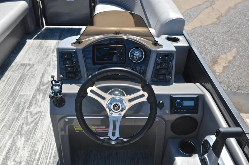 Slide: The Image of 2023 Qwest LT 822 boat dashboard with steering wheel and control panel. - 25