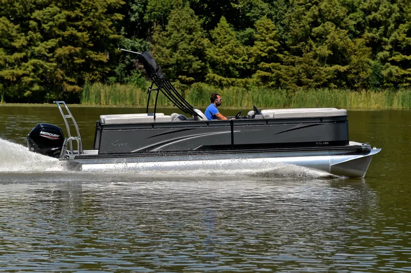 Slide: The Image of 2023 Qwest LT 822 pontoon boat cruising on a lake with lush green trees. - 3