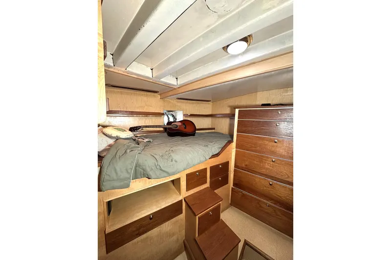 Slide: The Image of Cozy cabin interior of 1971 Southern Marine MALAHIDE Pilothouse LRC with bed and guitar. - 11