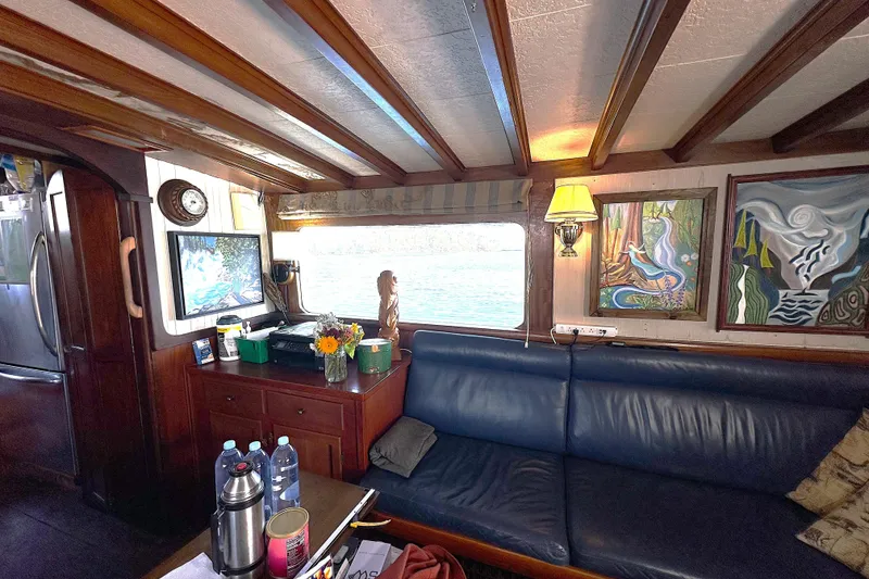 Slide: The Image of Interior of 1971 Southern Marine MALAHIDE Pilothouse LRC with art, sofa, and nautical decor. - 13