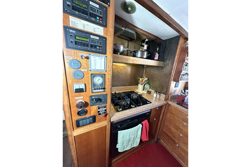 Slide: The Image of 1971 Southern Marine MALAHIDE Pilothouse LRC kitchen with control panel and stove. - 14
