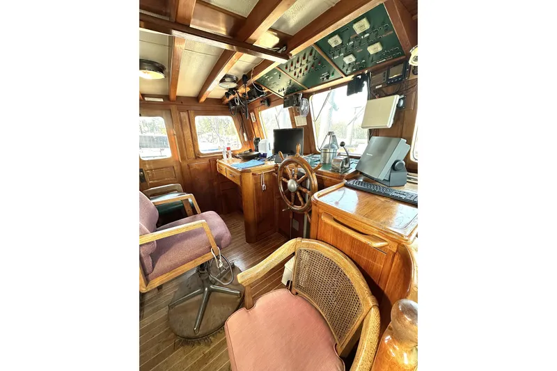 Slide: The Image of Vintage 1971 Southern Marine MALAHIDE Pilothouse LRC interior with wooden helm and navigation equipment. - 17