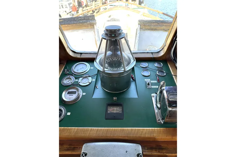 Slide: The Image of Pilothouse controls of 1971 Southern Marine MALAHIDE Pilothouse LRC, featuring gauges and compass. - 18