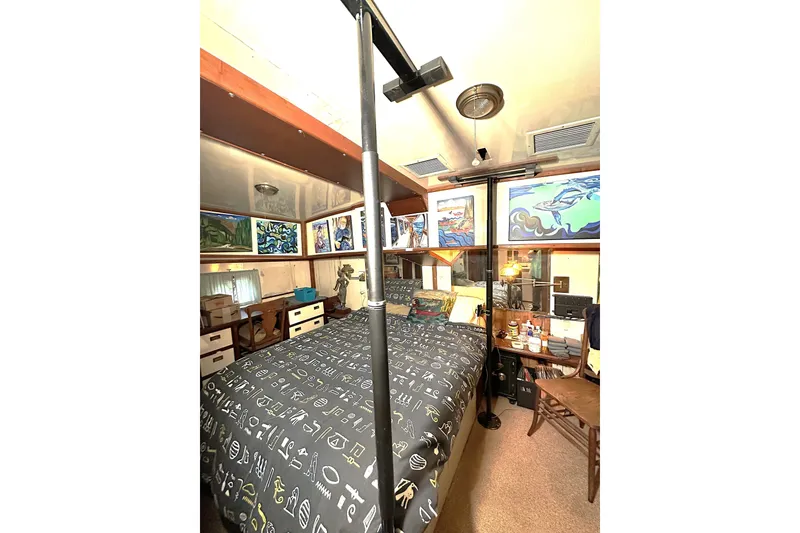 Slide: The Image of Cozy bedroom in 1971 Southern Marine MALAHIDE Pilothouse LRC with nautical decor and artwork. - 23