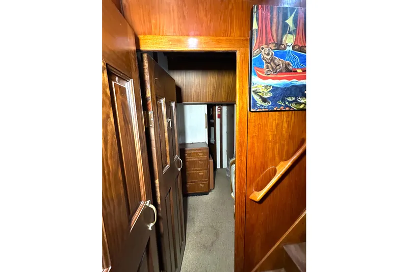 Slide: The Image of Interior of 1971 Southern Marine MALAHIDE Pilothouse LRC with wooden paneling and artwork. - 24