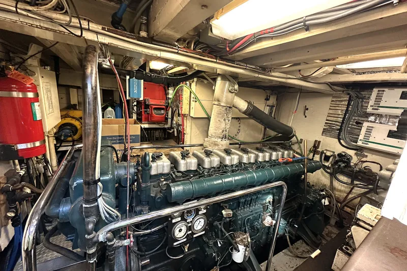 Slide: The Image of Engine room of a 1971 Southern Marine MALAHIDE Pilothouse LRC with visible machinery and equipment. - 28