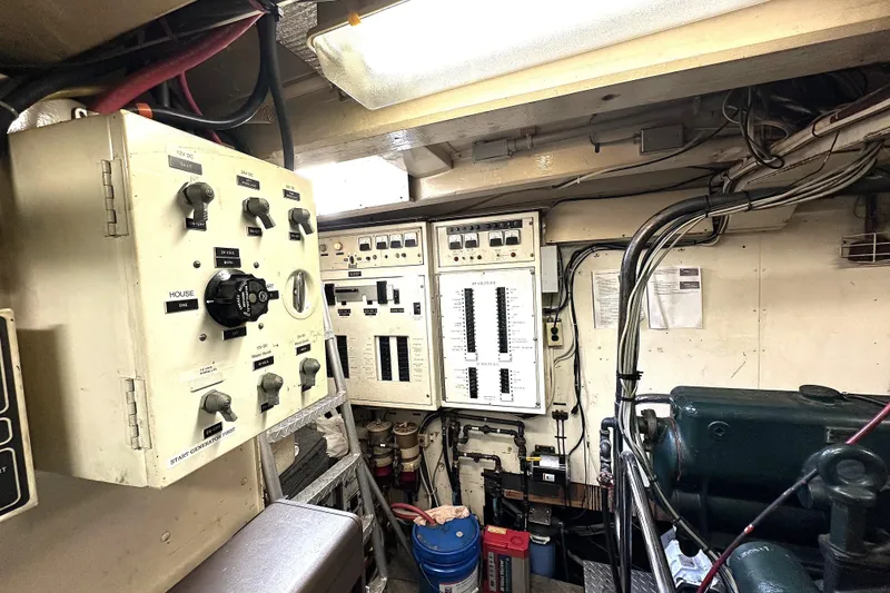 Slide: The Image of Electrical control panel inside 1971 Southern Marine MALAHIDE Pilothouse LRC, showcasing wiring and switches. - 29