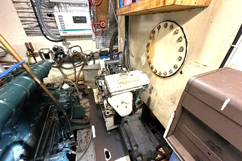 Slide: The Image of Engine room of 1971 Southern Marine MALAHIDE Pilothouse LRC with visible machinery and wiring. - 30