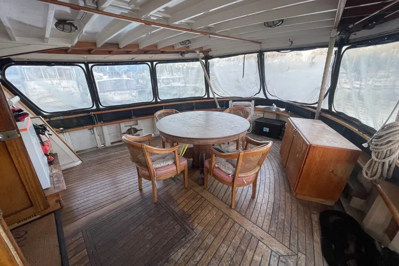 Slide: The Image of Interior of 1971 Southern Marine MALAHIDE Pilothouse LRC with wooden furniture and panoramic windows. - 34