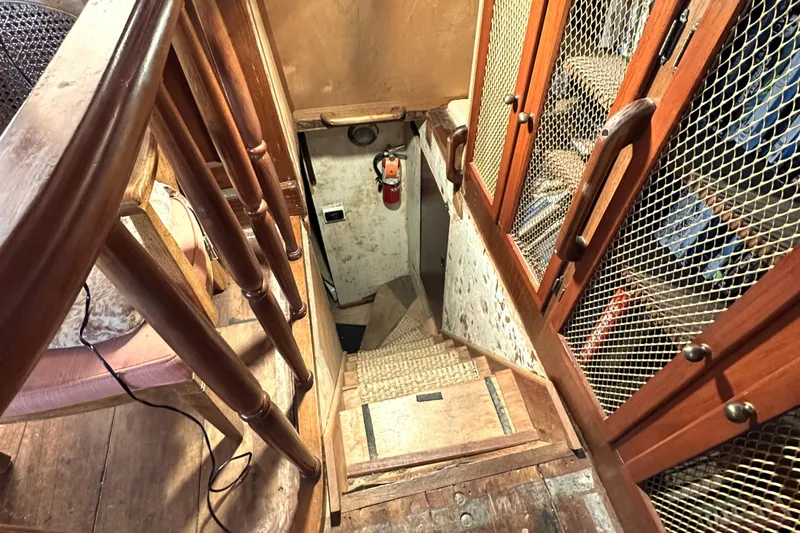 Slide: The Image of Wooden staircase and cabinets inside 1971 Southern Marine MALAHIDE Pilothouse LRC boat. - 8