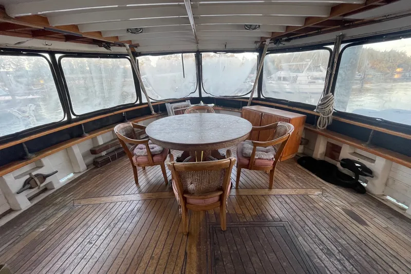 Slide: The Image of 1971 Southern Marine MALAHIDE Pilothouse LRC interior with round table and chairs. - 35