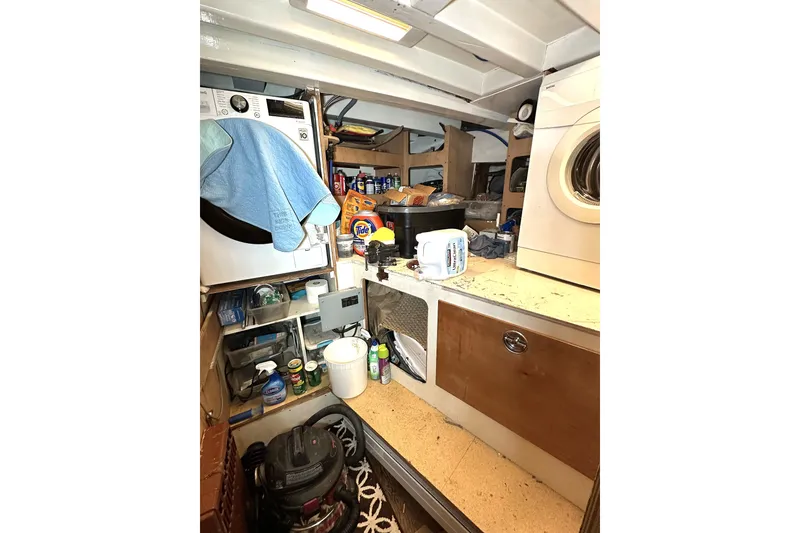 Slide: The Image of Laundry area inside 1971 Southern Marine MALAHIDE Pilothouse LRC with appliances and storage. - 9