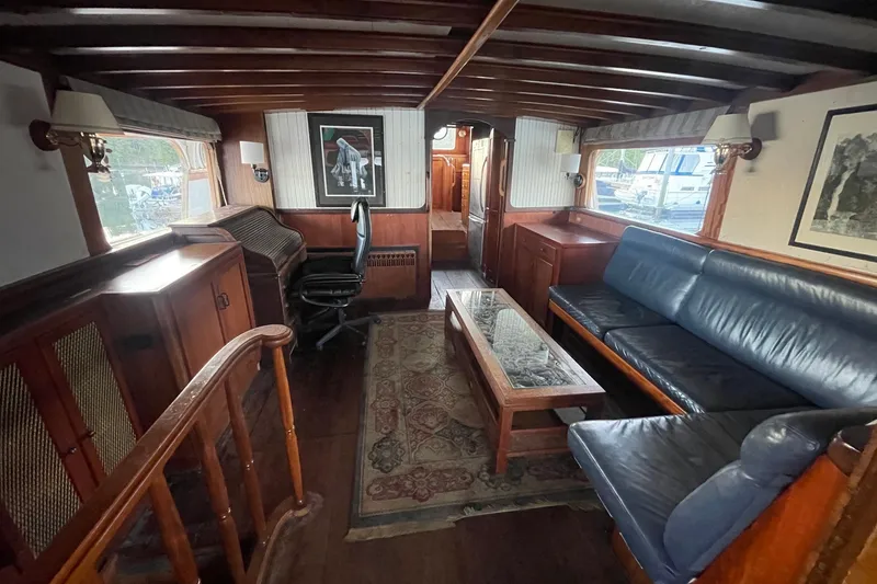 Slide: The Image of Luxurious 1971 Southern Marine MALAHIDE Pilothouse LRC interior with wooden furnishings and leather seating. - 36