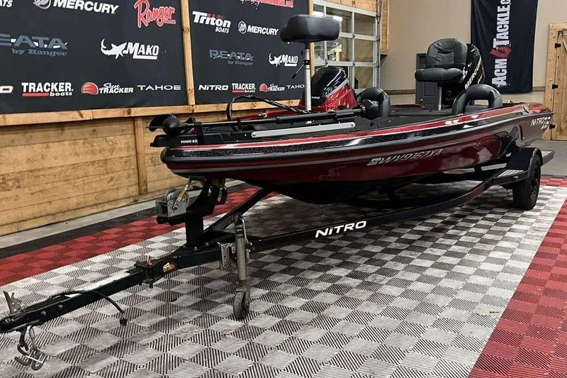Slide: The Image of 2011 Nitro Z6 boat on trailer in showroom with branded backdrop. - 5