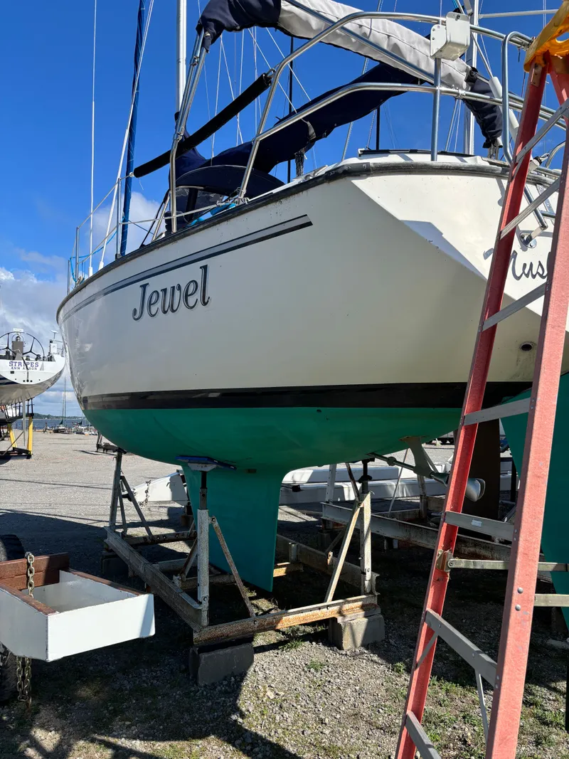 Slide: The Image of Sailboat "Jewel" on dry dock, S2 8.5 model, 1982, with blue sky background. - 5