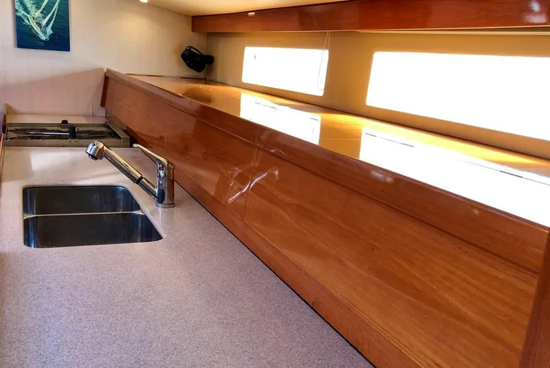 Slide: The Image of Luxurious wooden kitchen interior of 1995 Kelly Dashew KELLY ARCHER yacht with modern sink. - 20
