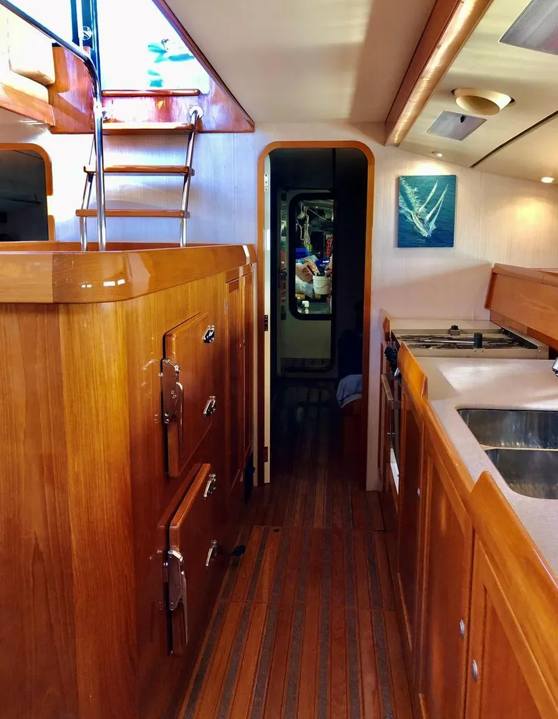 Slide: The Image of Interior of 1995 Kelly Dashew KELLY ARCHER yacht with wooden cabinetry and modern kitchen amenities. - 21
