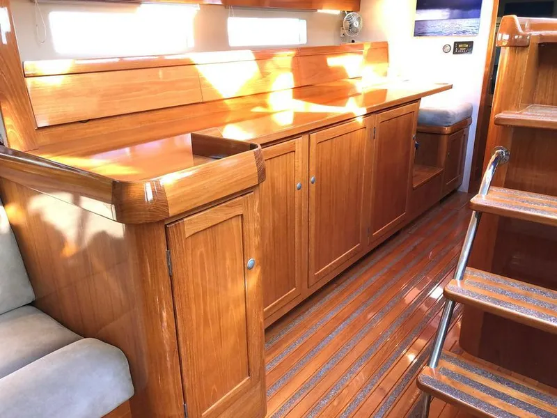 Slide: The Image of Interior of 1995 Kelly Dashew KELLY ARCHER yacht with polished wood cabinetry and stairs. - 24