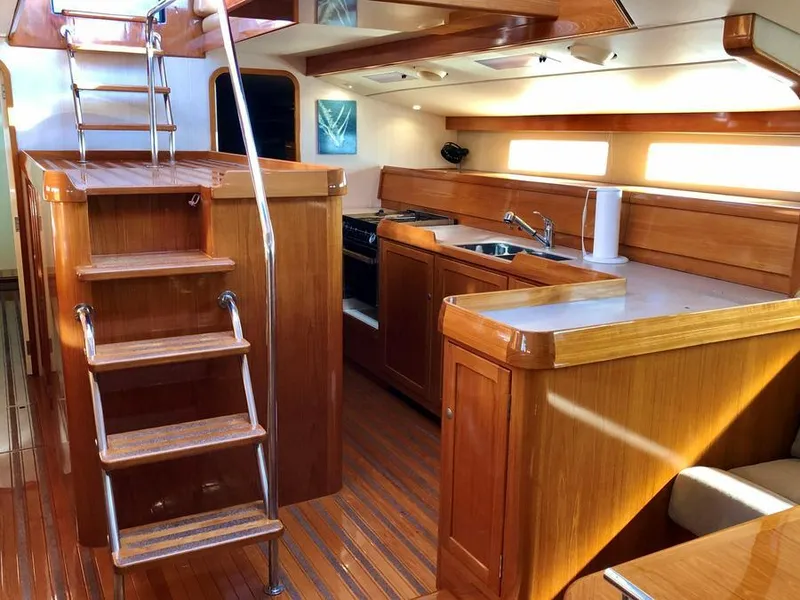 Slide: The Image of Interior of 1995 Kelly Dashew KELLY ARCHER yacht with wooden cabinetry and staircase. - 25
