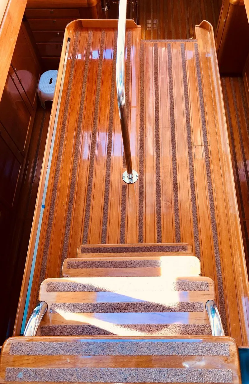 Slide: The Image of Wooden staircase on 1995 Kelly Dashew KELLY ARCHER yacht, featuring polished handrails. - 26