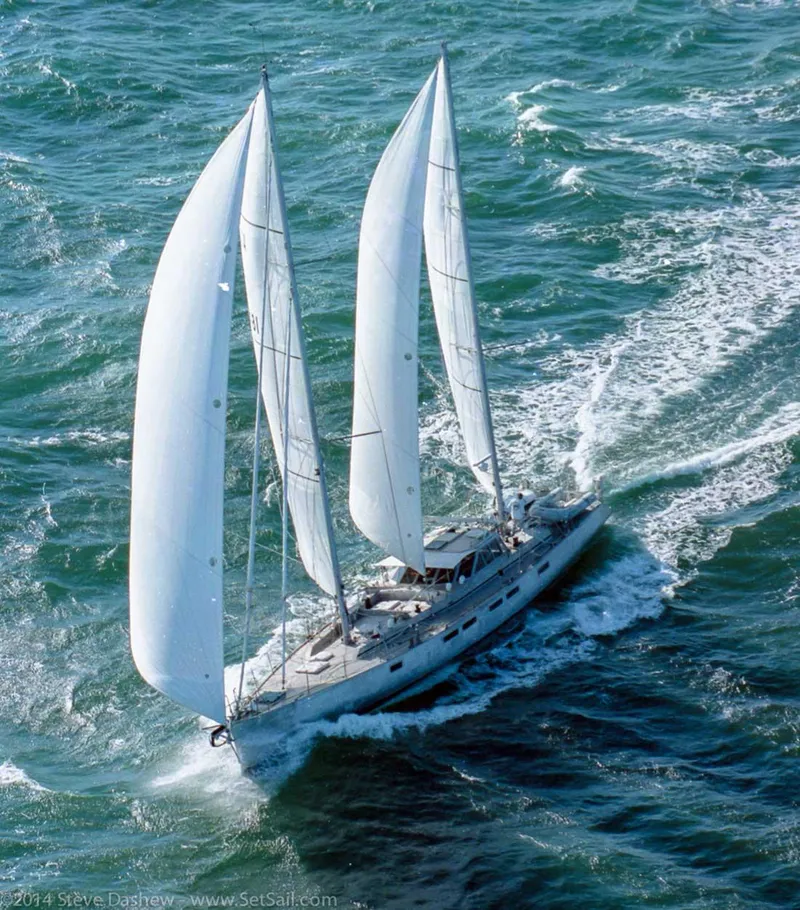 Slide: The Image of Sailing yacht "Kelly Dashew Archer" 1995 navigating through ocean waves with full sails. - 3