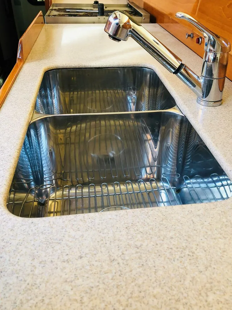Slide: The Image of Stainless steel double sink with modern faucet on a Dashew Kelly Archer yacht, 1995 model. - 31