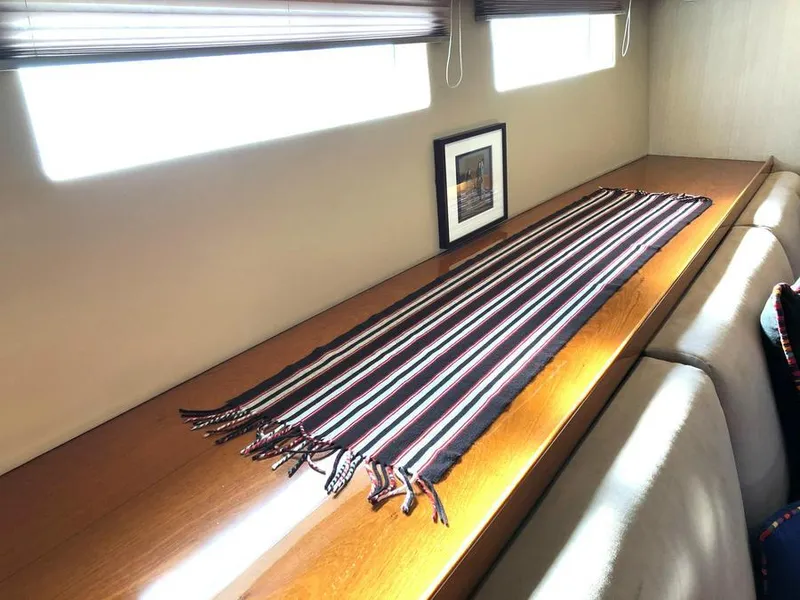 Slide: The Image of Interior of 1995 Kelly Dashew KELLY ARCHER yacht with striped table runner and framed artwork. - 38