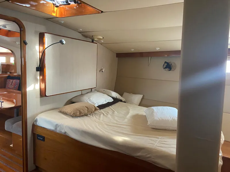 Slide: The Image of Cozy cabin interior of 1995 Kelly Dashew KELLY ARCHER yacht with bed and wooden accents. - 42