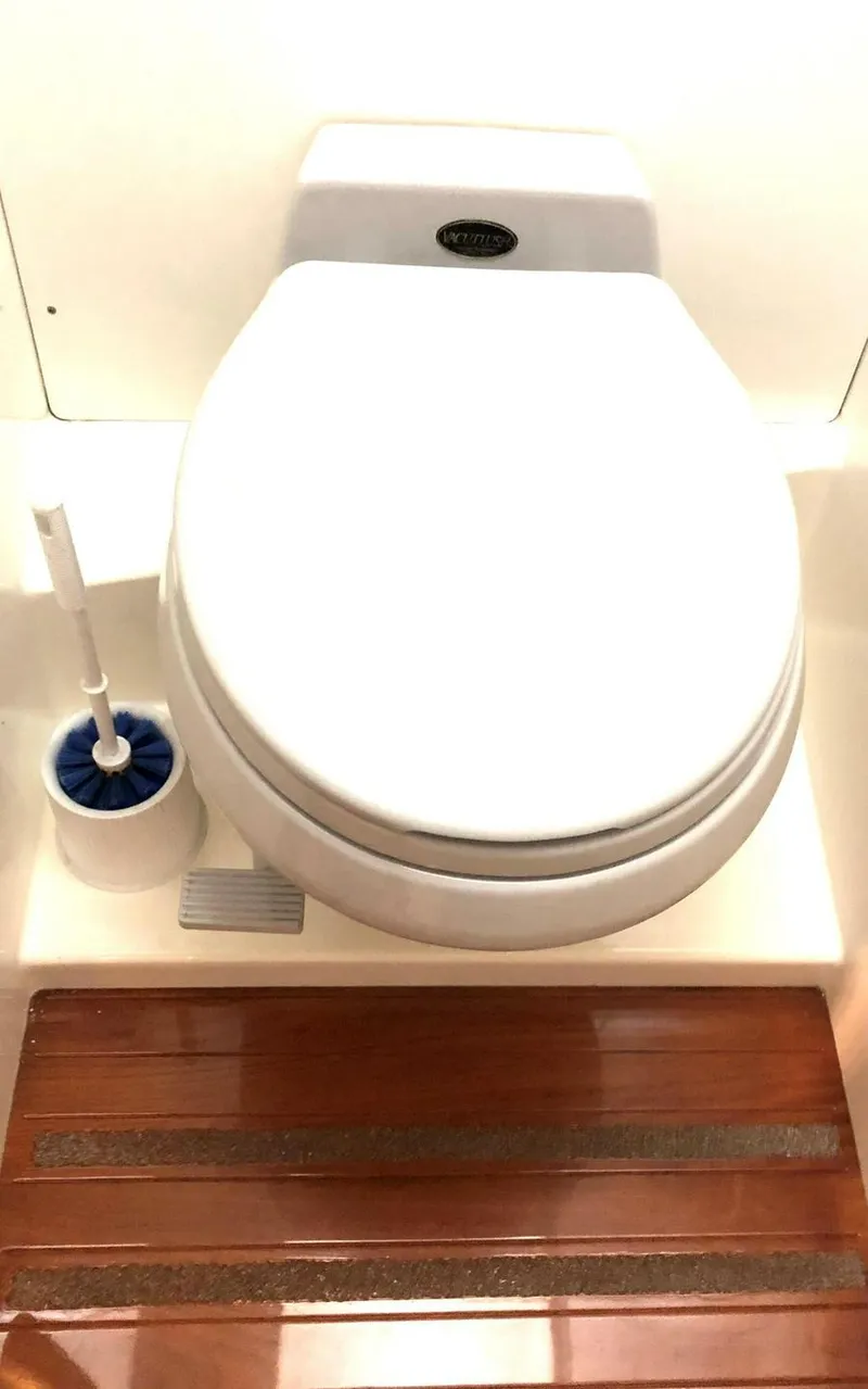 Slide: The Image of White toilet with wooden floor, Kelly Dashew KELLY ARCHER 1995 model, includes brush holder. - 44